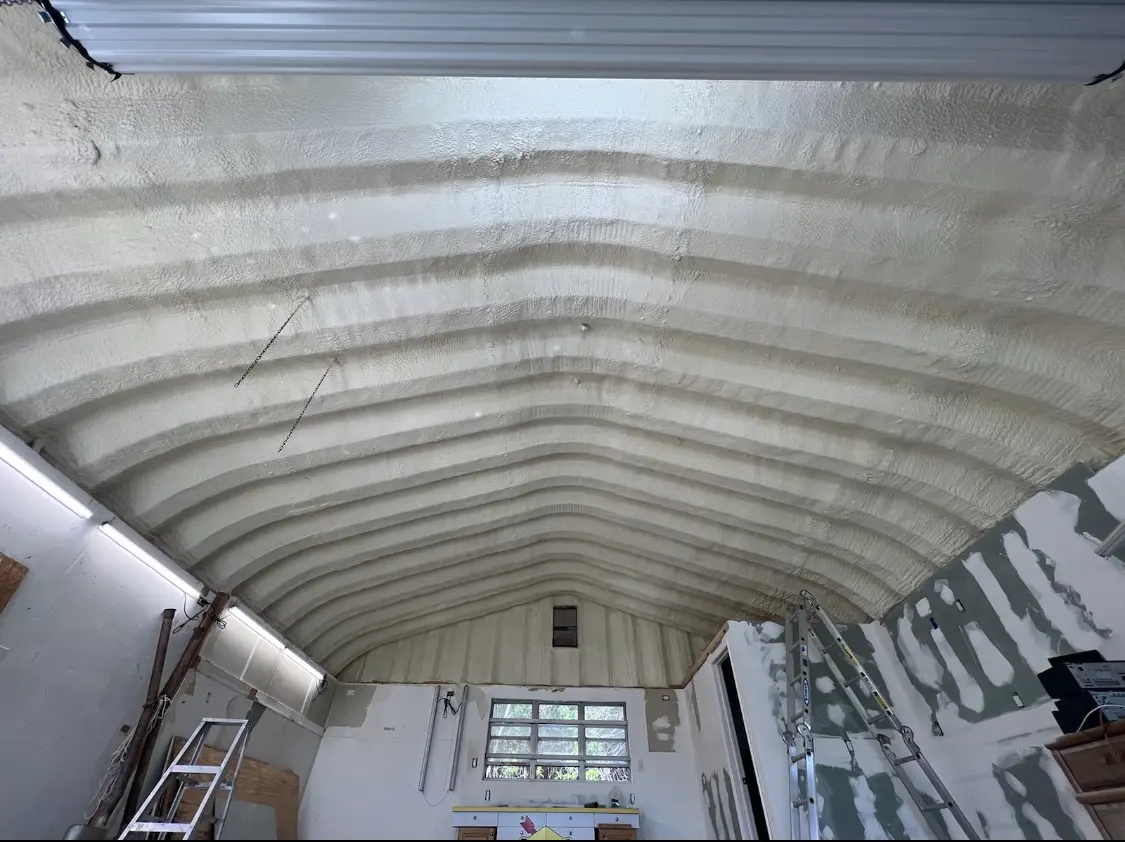 Spray polyurethane foam applied to the underside of a metal roof deck in Newington